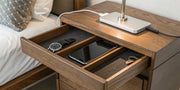A wooden mens nightstand organizer with a wireless charging station for a phone, watch, and keys.