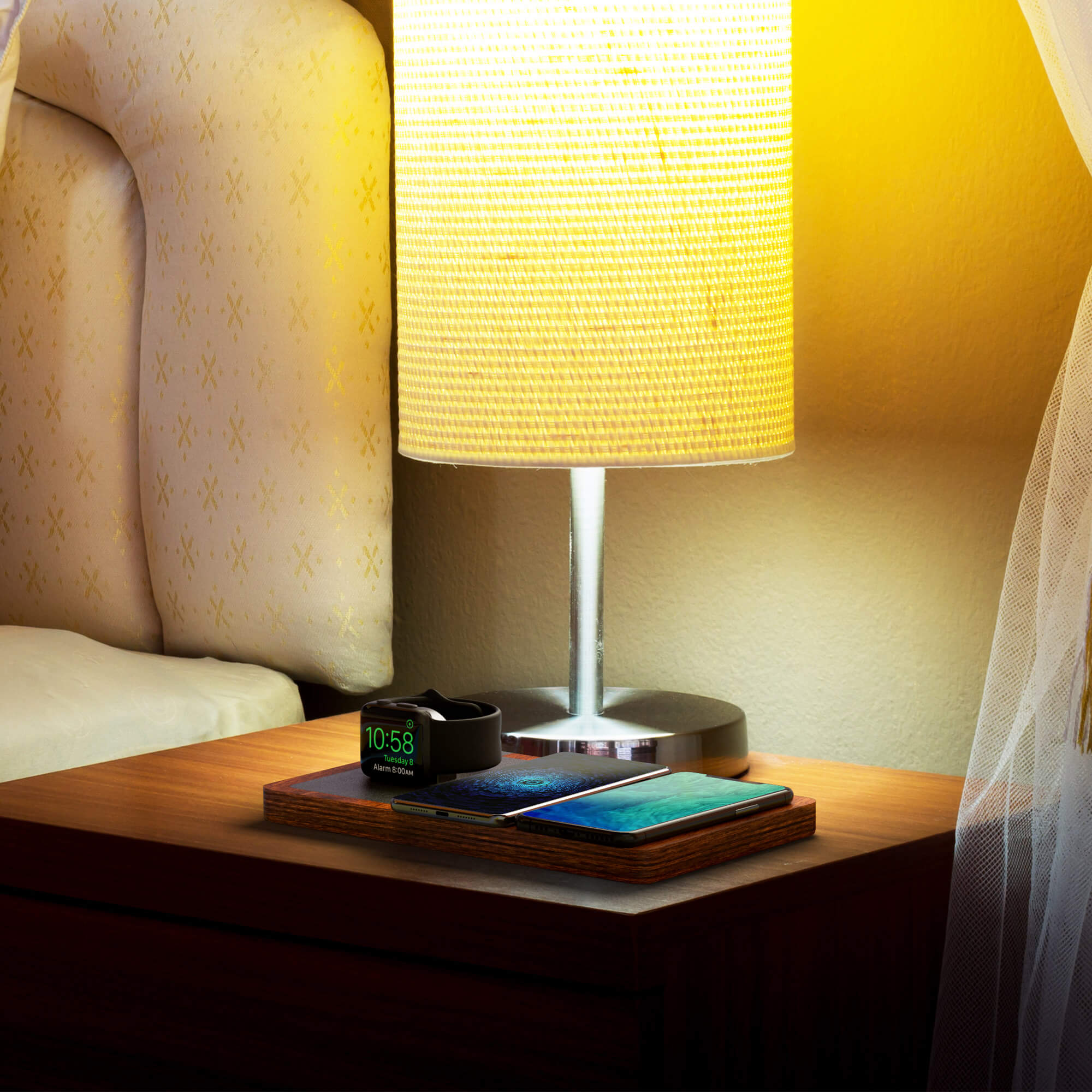 NYTSTND TRIO lifestyle picture on nightstand charging Apple watch, , iPhones