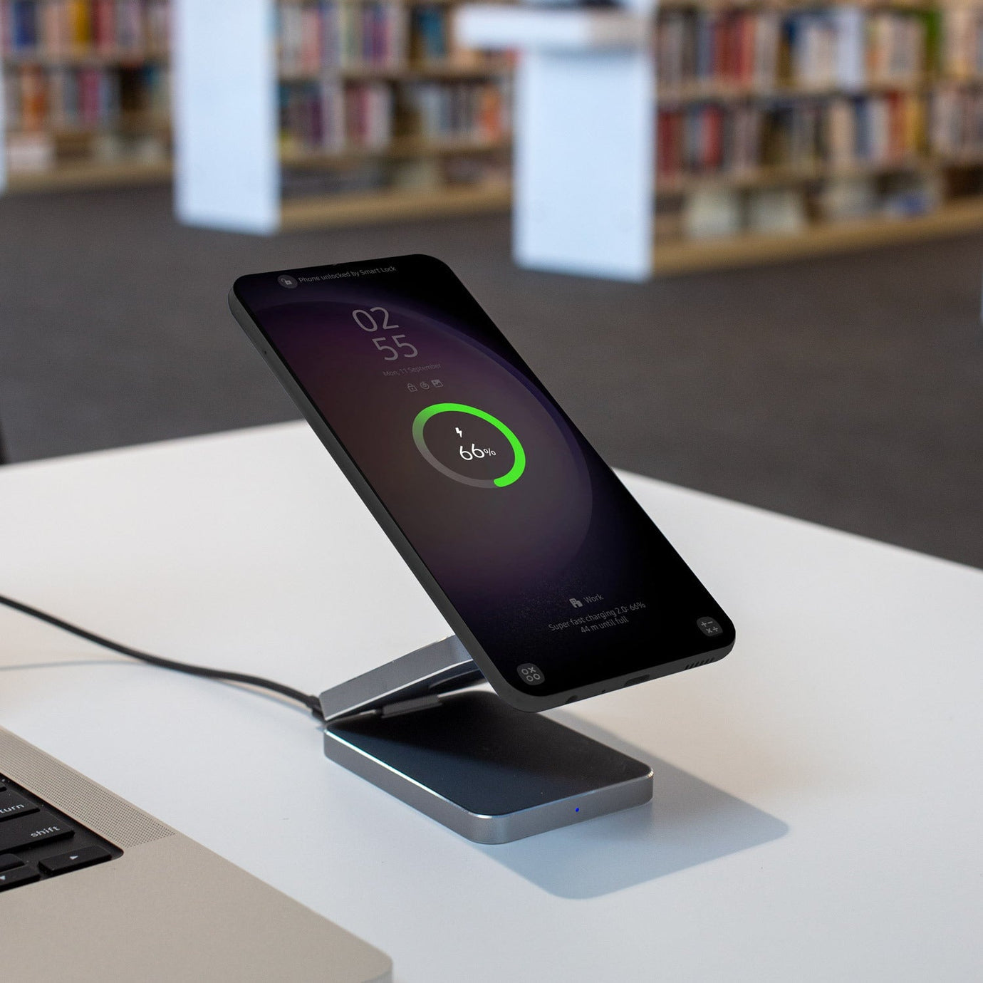 Foldable 3-in-1 Apple charger simultaneously charging an iPhone, Watch, and AirPods.