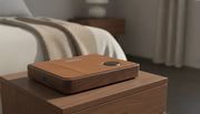2 in 1 charging dock on a compact walnut nightstand with an iPhone and Apple Watch
