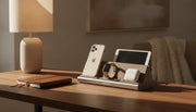 4 in 1 charging stand organizing an iPhone, Apple Watch, AirPods, and tablet on a warm wood desk