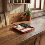 An office charging station on a modern desk keeping a laptop, phone, and tablet powered up.