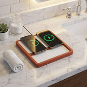 Dual charging dock powering two smartphones on a modern desk.