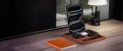 Wooden multi-device charging station neatly organizing a tablet and smartphones.