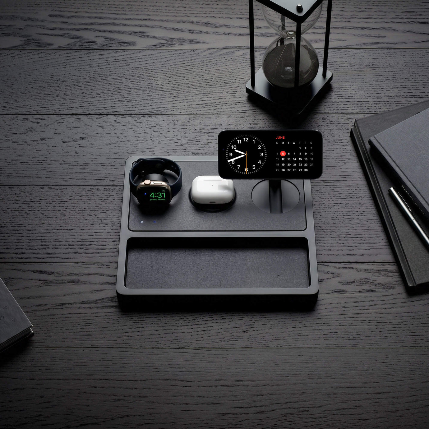 Premium wood and leather wireless charging station with iPhone and AirPods on a nightstand