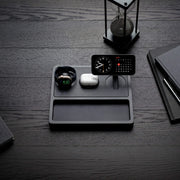 Premium wood and leather wireless charging station with iPhone and AirPods on a nightstand