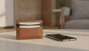 Premium full-grain leather MagSafe wallet in saddle brown and black with a slim cardholder profile
