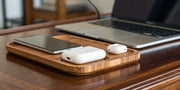 Wooden wireless charging station for Apple devices.