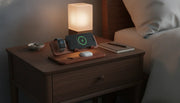 Premium wooden wireless charging station on a nightstand with iPhone, Apple Watch, and AirPods
