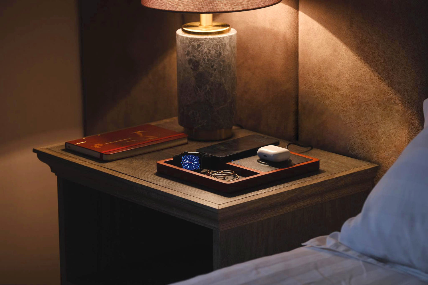 Compact dual wireless charger for an iPhone and AirPods.