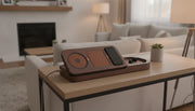Premium wood and leather multi-device charging station on a modern console table