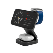 An Apple Watch connected to its white magnetic charger.