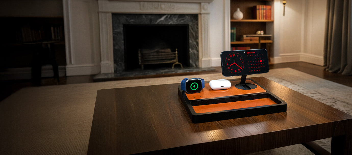 A stylish designer MagSafe charger on a nightstand charging an iPhone and AirPods.