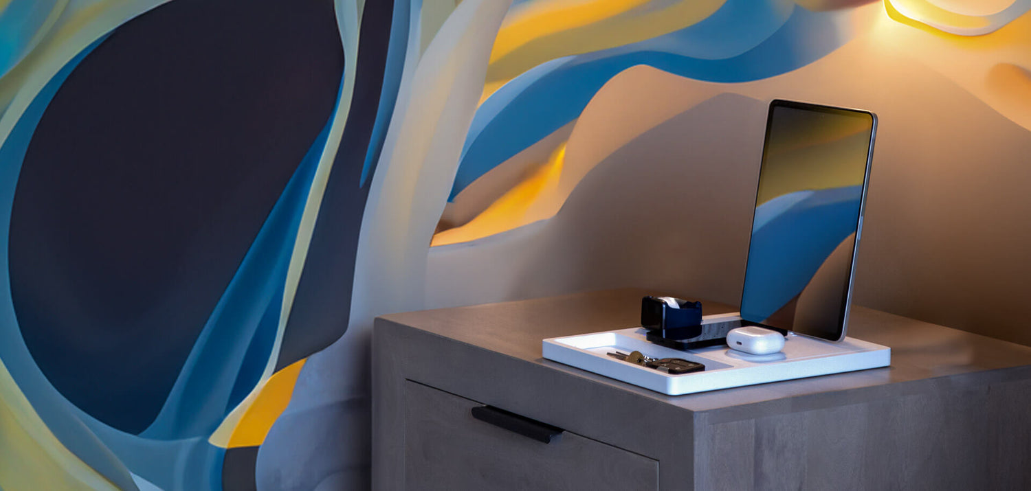 An Apple Watch charging on a premium wooden dock.