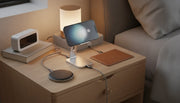 Premium wireless charging stations on a wooden nightstand featuring MagSafe, Qi2, and standard Qi chargers