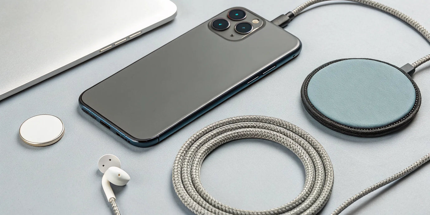 A smartphone magnetically attached to a Qi2 MagSafe charger.