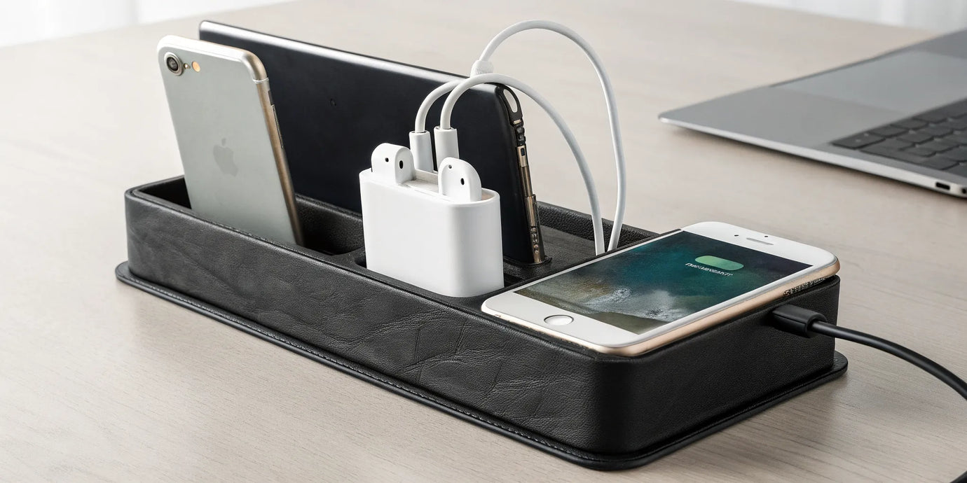 The NYTSTND TRIO charger, with its premium design, powering three devices at once on a desk.