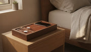 Premium handcrafted wood and full-grain leather wireless charging valet tray on a clean bedside nightstand