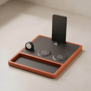 A premium leather wireless charger with a smartphone, showing the quality that determines its price.