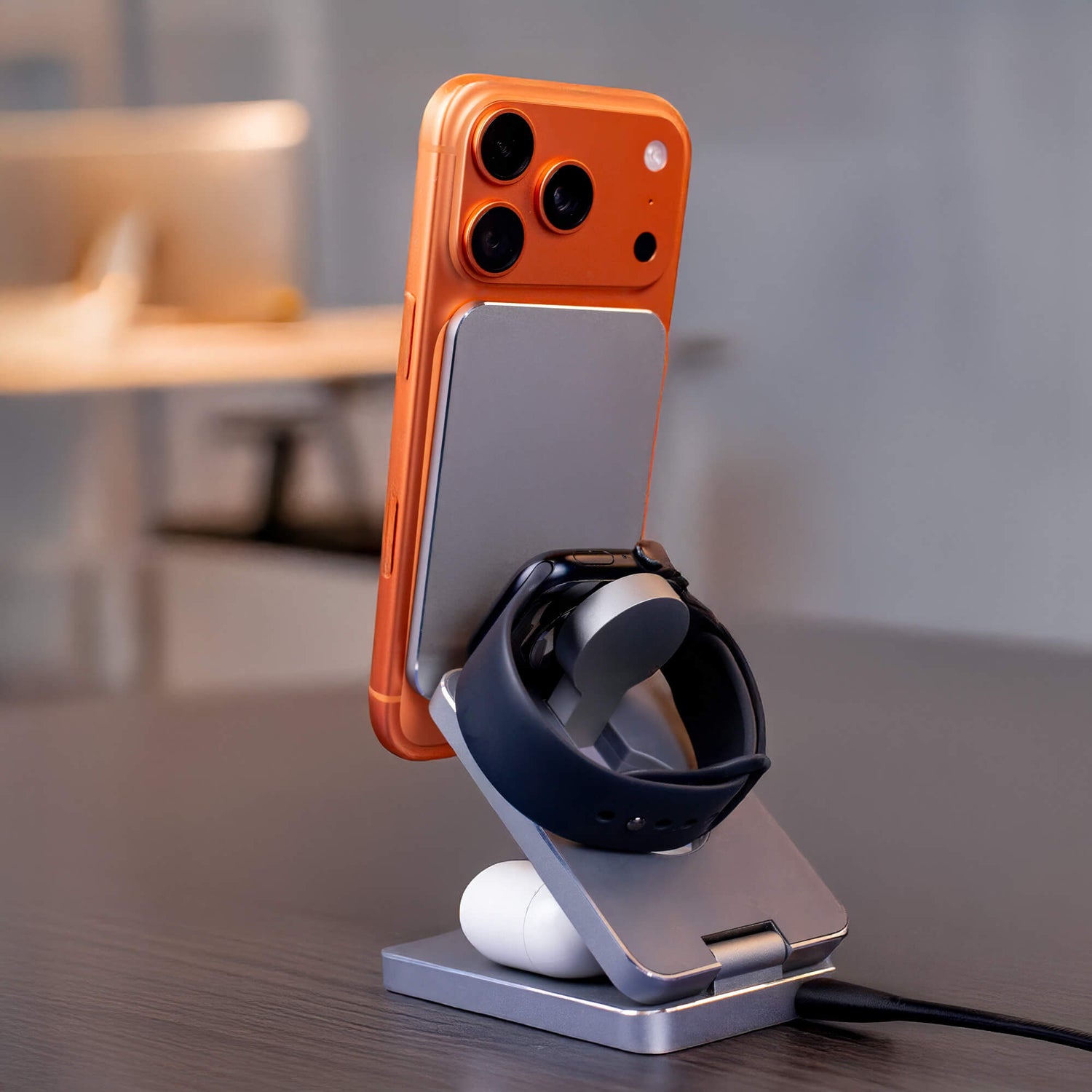 One of the best collapsible chargers for travel packed in a bag with a phone and passport.