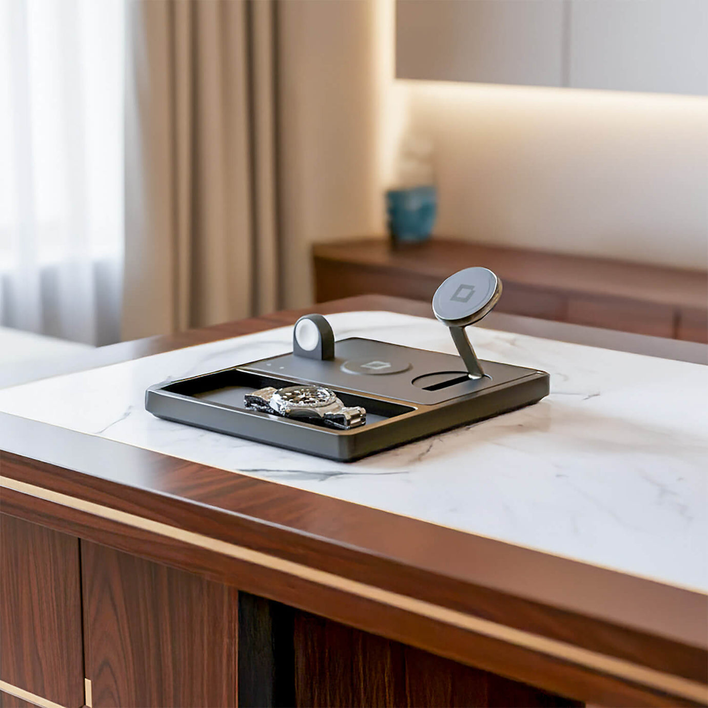 A multi-device charging dock organizing and powering a phone and watch on a wooden desk.