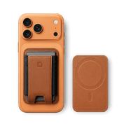 Luxury full-grain leather MagSafe wallet on a wood surface next to an iPhone