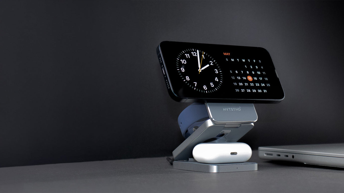 iPhone on MagSafe charging stand.
