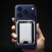 Reviewing the best leather MagSafe wallet attached to a smartphone.