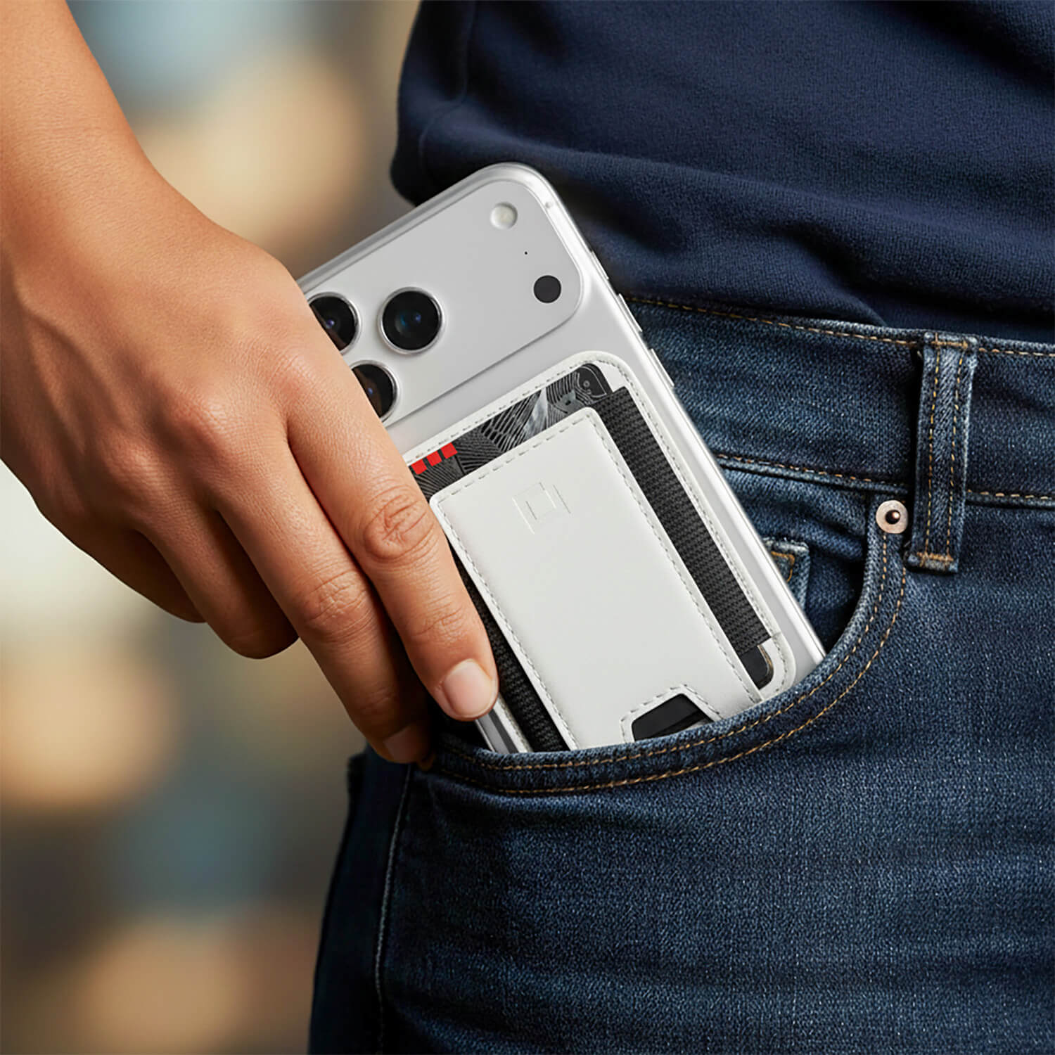 Best MagSafe wallet for men in brown leather attached to an iPhone.