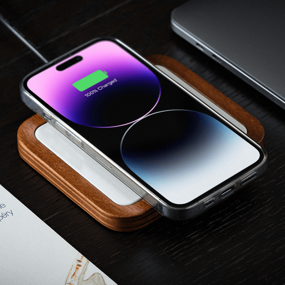 UNO White - Single-Coil MagSafe Oak Wireless Charger, lifestyle picture charging iPhone
