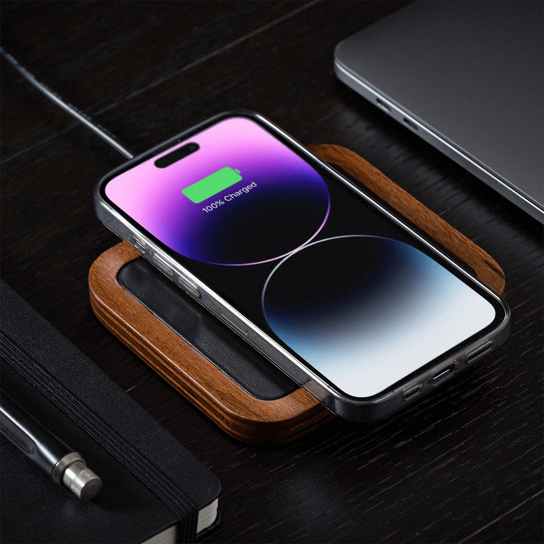 UNO Black - Single-Coil MagSafe Oak Wireless Charger Angle view Charging iPhone